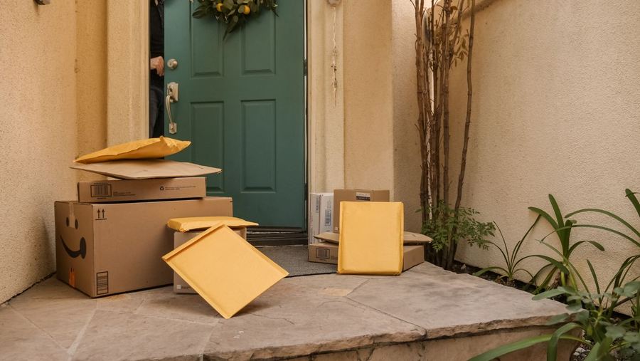 Amazon boxes and parcels waiting at the front door