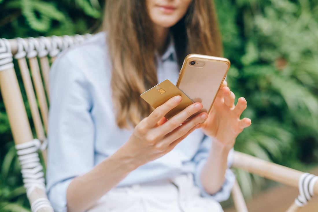A customer shopping online on her phone